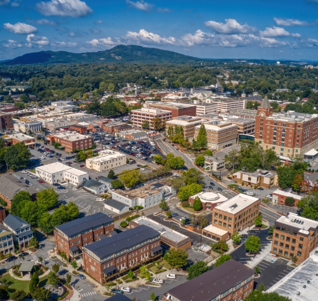 Aerial view of downtown city with mountain in a background